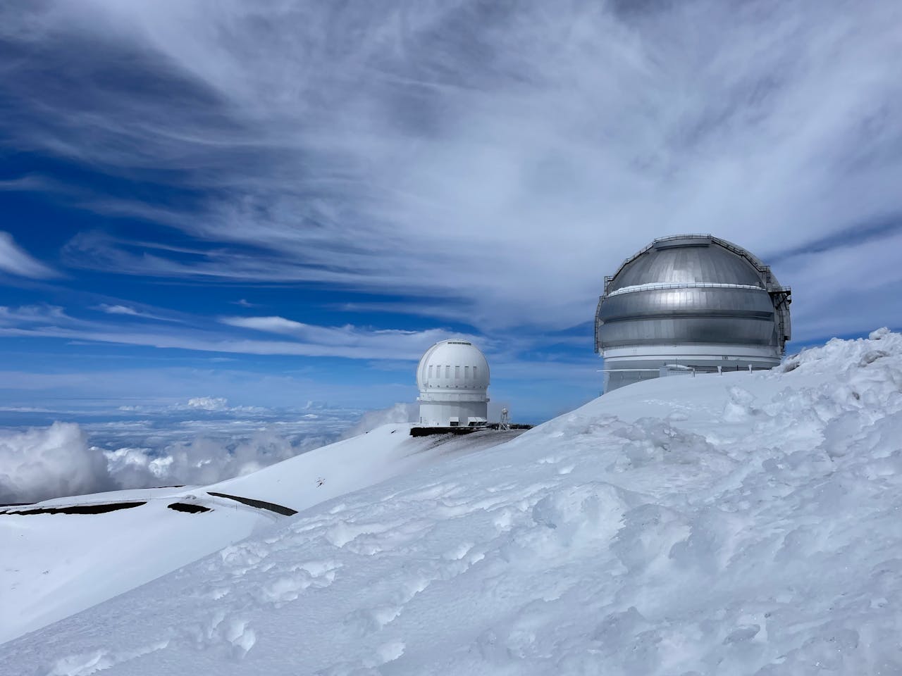 Crafting Captivating Headlines: Your awesome post title goes here Observatory domes in a snowy landscape under a clear blue sky, capturing the essence of winter.